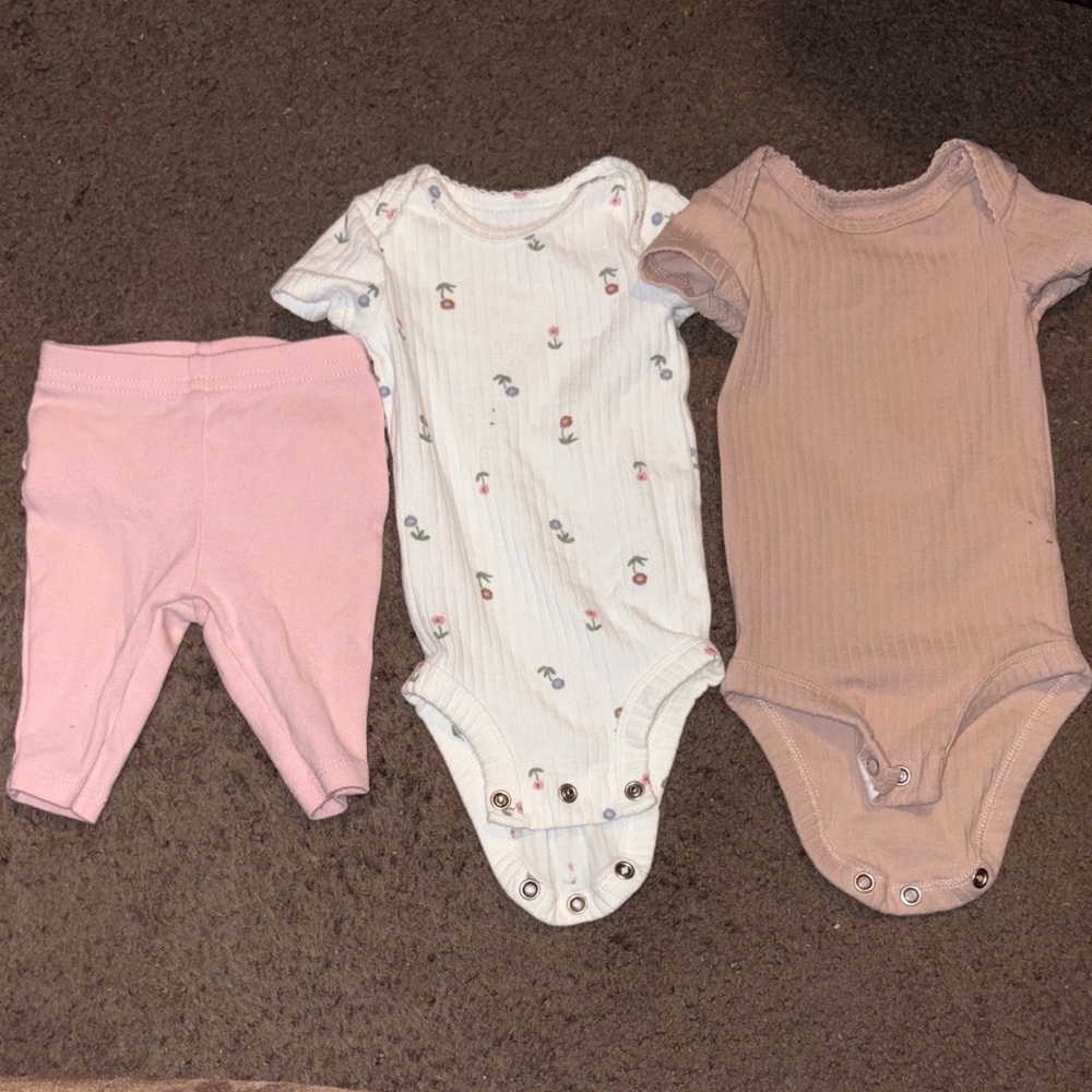 Bundle of baby girls carters clothes- one pair of ruffle butt pants, two onesies